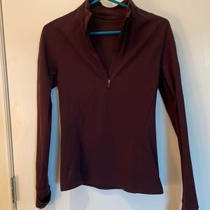 Lululemon maroon color half zip with zippered pocket on the back for your key